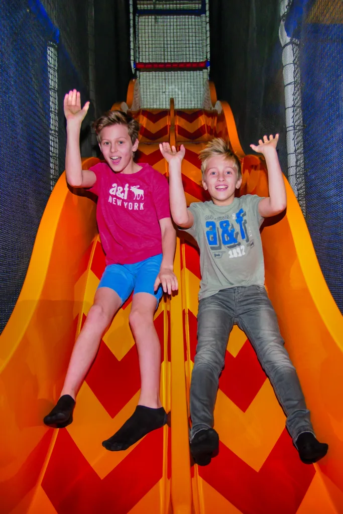 Kids on the soft play slides