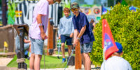 Family playing crazy golf